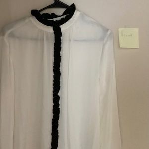 Zara white too with black detail on the color and running down the blouse